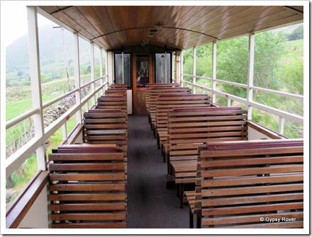 Open air carriage on the Welsh Highland railway for avid photographers. Not many today.