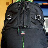 The Kata DR-467i holds the camera along with acessories in the bottom compartment, other gear and miscellaneous things in the top compartment and a 15“+ laptop in the rear laptop compartment