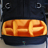This is the camera compartment. Bright yellow so that you can spot even the smallest accessory. This padded area can also be removed to turn the bag into a normal backpack