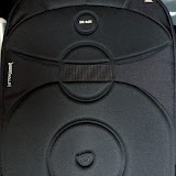The back of the bag is nicely padded. There is also a elastic strap towards the top so that you can secure the bag on a strolley while travelling