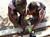 Zoey and Naomi learning basic carpentry, as well as butshing up on maths and measuring.