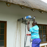Drilling a concrete core from a ringbeam - water flushes out the dust and cools the cutting edge.
