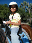 Gwyneth on Sammy, wearing her Chips helmet.