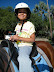 Gwyneth on Sammy, wearing her Chips helmet.