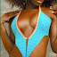 Yoneaque Is modeling a v-cut,
turquoise/baby-blue low-rider
crocheted bikini. Designs by
Nadia Smith &amp;
Laquanna Bramble
Call: 347-278-2122