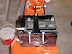 Rear top of battery box with stock rear fender bolts sitting in place and front bolt for frame center post in place. MSS