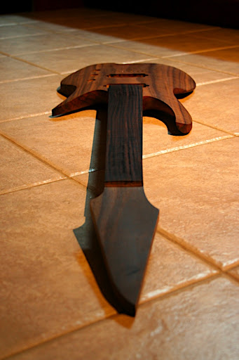 The body has about a 15" or 16" radius on the top, which you can see gives some dramatic curves and sweeps to the lines of the guitar.