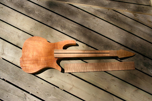 dB1 Javelin. The first "production" Decibel Guitar. Figured mahogany body, 5-piece roasted curly maple + figured mahogany multi-laminate neck. Roasted curly maple fretboard.