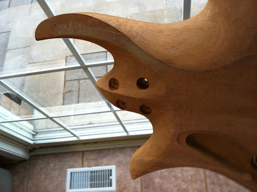Rough contours carved on the back. The ridge on the neck heel will blend into the asymmetrical soft V on the upper part of the neck.