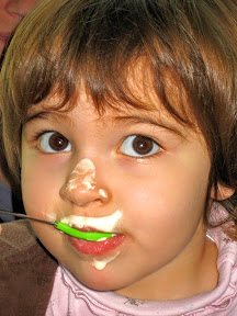 Cassie, the 2-year old. Some of it also goes into her mouth