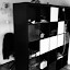 My home office is hidden behind this shelving unit My home office is hidden behind this shelving unit