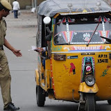 Policemen check curfew pass in Hyderabad's old city on Tuesday.