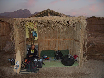 Those straw huts are cute, but taller people will need to cut out holes to extend their legs if they expect any kind of comfort :)...