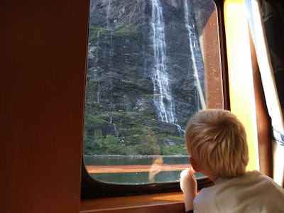 My son looking out at the waterfall the seven sisters