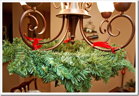 i tied the wreath to the base on each stem of the chandelier of course this clearly took a joint effort so mr spouse - How To Decorate A Chandelier For Christmas i tied the wreath to the base on each stem of the chandelier of course this clearly took a joint effort so mr spouse - How To Decorate A Chandelier For Christmas