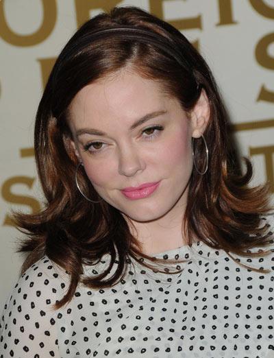 Rose McGowan wearing a shoulder length layered headband hairstyle while 