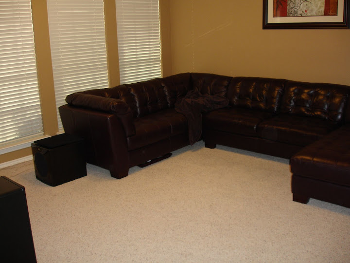 subwoofer behind couch