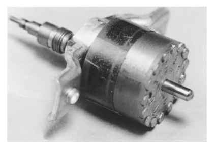 Shaded-pole synchronous motor rotor showing induction motor bars and end rings.