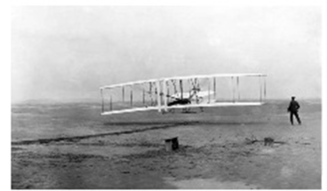 The Wright brothers making their first successful powered flight, at Kitty Hawk, North Carolina. 