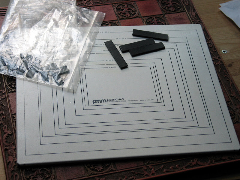 How to keep paper flat under enlarger?