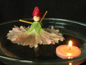 Floating Hollyhock Doll and Candle