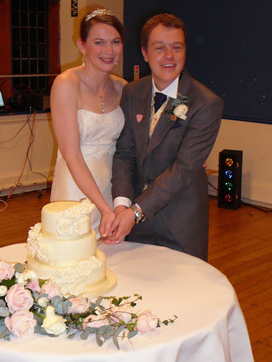 T & C cutting the cake
