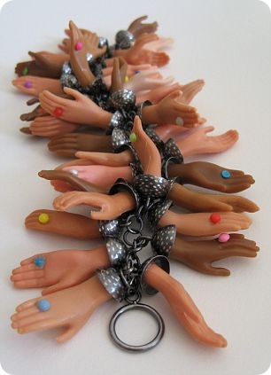 Barbie hands make up a colourful bracelet Barbie hands make up a colourful bracelet