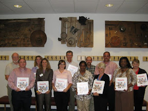 people posing with notebooks