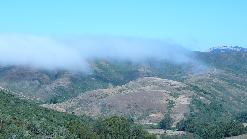 fog is floating around the top of mountains fog is floating around the top of mountains
