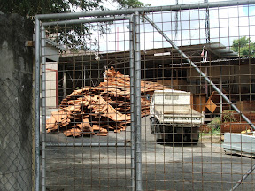 locally cut lumber piled up at the THA Works Division 