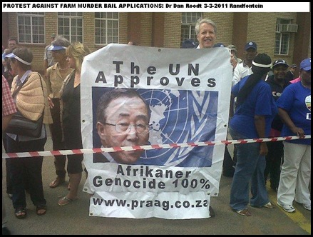ROODT DR DAN PRAAG protesting against farm murderers bail application RANDFONTEIN MARCH 13 2011 huge placard