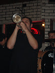 Photo: Rob takes a brass band trumpet solo at Cooler Near the lake.