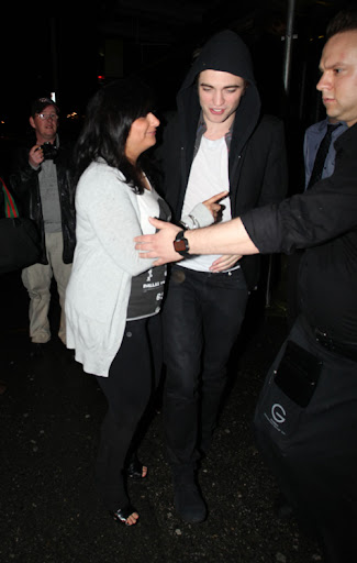 IMAGE ID # 2193060 Robert Pattinson celebrates his 23rd birthday in Vancouver, BC, Canada Wednesday night. Fans endured the rainy weather for a chance to see Robert and he was gracious enough to pose with a few of them before leaving. Despite his last year being a life-changing one for the young heartthrob, Pattinson remained somewhat subdued while celebrating his birthday with castmates and friends. 05/14/2009 --- Robert Pattinson --- (C) 2009 Fame Pictures, Inc. - Santa Monica, CA, U.S.A - 310-395-0500 / Sales: 310-395-0500