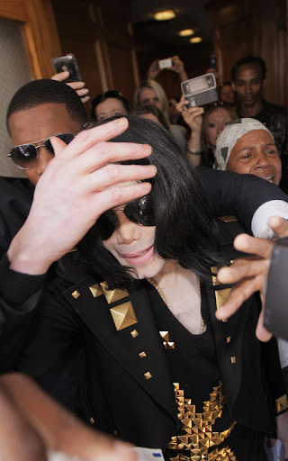 **File Photo** * JACKSON HOSPITALISED AFTER CARDIAC ARREST - REPORT MICHAEL JACKSON is reportedly in hospital after suffering a heart attack. The Thriller superstar's aides frantically called an ambulance to come to Jackson's Holmby Hills mansion in Los Angeles earlier today (25Jun09), according to TMZ.com. Reports suggest the singer's condition was so bad, medics were forced to administer CPR en-route to a nearby hospital - to keep him alive. Jackson's worried family members are allegedly rushing to his bedside. Earlier this month (Jun09), family insider Arthur Phoenix told WENN the superstar was in a bad way and should not be considering a 50-concert run in London, scheduled to start in July (09). He insisted the concerts would not happen, stating, "Michael is not mentally, physically or spiritually ready for these shows. There's something missing in his soul... It's over! There are family members who feel the same way but they're afraid to speak." Phoenix fears the pressure of the c