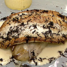 Sauteed Turbot with Braised Endive, Celery Root Flan, Black Truffles, and Garlic Nage
