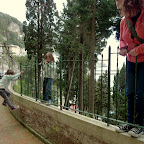 Everyone hops the locked fence to get a better view.