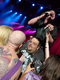 Mike Patton croons 'Ben' while sitting a large man who looks like he wants to make-out with the hairless tattoo chick.