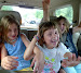 Tangled arms in the back seat dance to Lady Gaga