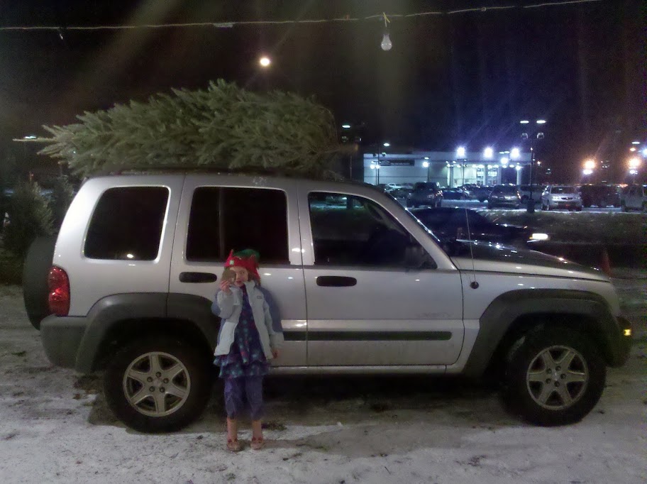Sophia and the tree on the Jeep