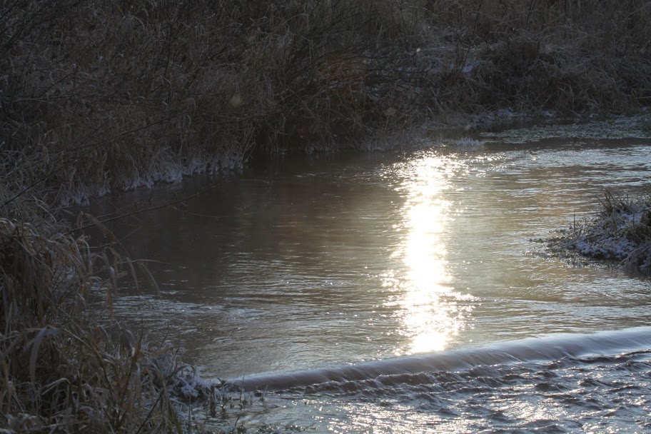 Sunrise reflecting in the Monolith Pool