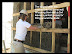 RDLP installing dipped straw bales into the frame