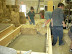 Buttered bales are placed into the plaster in the form box