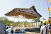 The completed roof is craned onto the prefabricated straw bale wall panels
