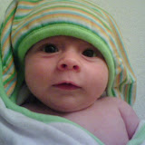After bathtime, wearing her hooded towel. (May)
