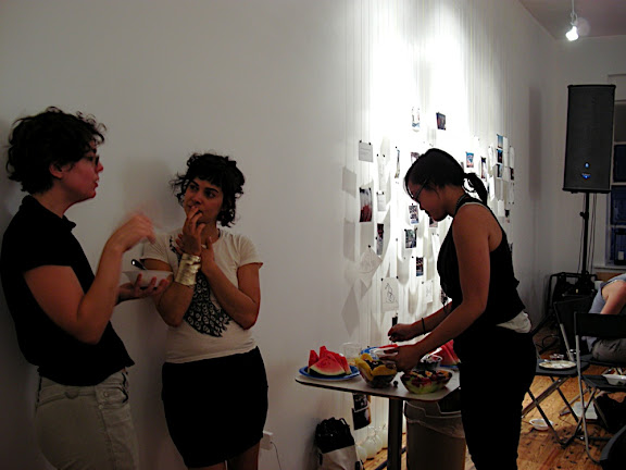 socializing! Glenda Reed and Christina Ferwerta talk while Julie Hugh enjoys the lovely fruit platter!