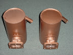 Stainless Steel Exhaust Riser Cans.
These can style risers are designed and built to fit the 175 hp naturally aspirated Hino engine, installed in the 38' Bayliner. These risers shown replace the low drop style cast iron Hino risers. This exhaust package