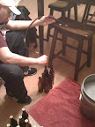 Alley checking me out as I bottle the brew.