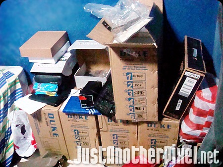 Boxes of computer parts in my room - JustAnotherPixel.net
