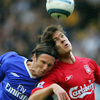 Chelsea's Alexey Smertin (L) fights for the control of the ball next to Liverpool's Xabi Alonso () at Chelsea football club in London 03 October 2004 during their premiership football match. AFP PHOTO/ Nicolas ASFOURI.