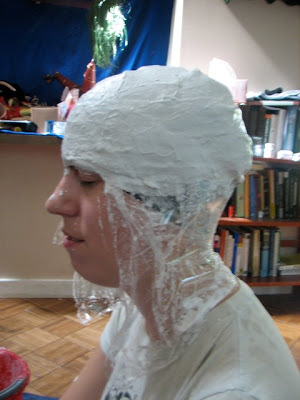 head covered in plaster